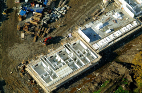 Aerial view of construction site and buildings.