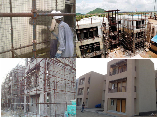 Building construction with scaffolding and workers.